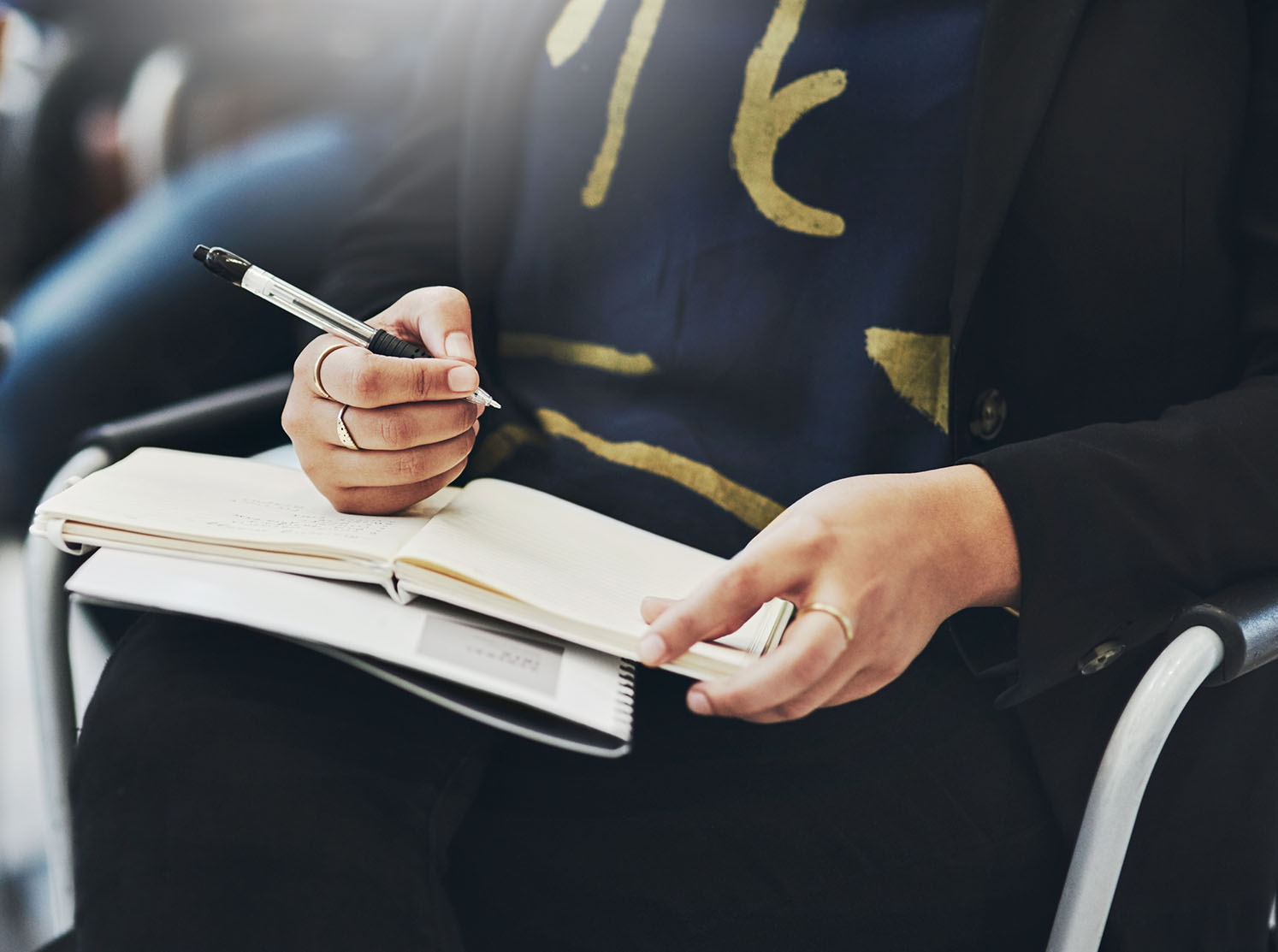 Professional training participant taking notes during a health and social care training session by RSDO Training